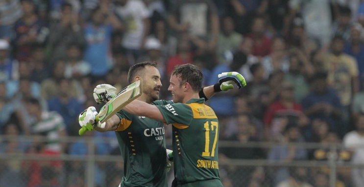 South Africas Faf du Plessis, left, celebrates his hundred runs captain A.B. de Villiers during the final one-day international cricket match of a five-game series against India in Mumbai, India, Sunday, Oct. 25, 2015. (AP Photo/Rajanish Kakade)