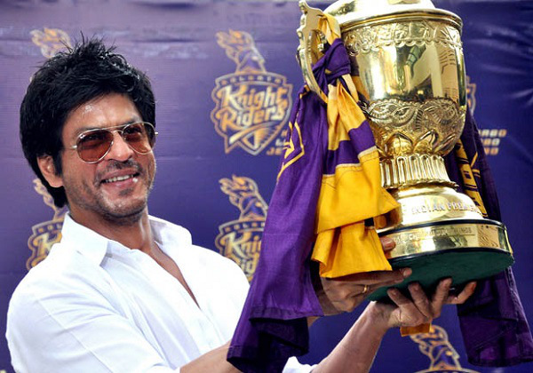 Indian Bollywood actor and Indian Premier League franchise Kolkata Knight Rider?s co-owner Shah Rukh Khan poses with the IPL trophy during a press conference in Mumbai on May 30, 2012. Kolkata Knight Riders claimed victory in the annual IPL Twenty20 cricket tournament final on May 27, beating defending champions Chennai Super Kings by five wickets. AFP PHOTO/STR        (Photo credit should read STRDEL/AFP/GettyImages)