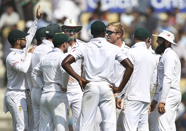 South African cricketers celebrate the fall of an Indian wicket on the first day of the third test match between the two countries in Mumbai, India, Wednesday, Nov. 25, 2015.(AP Photo/Rafiq Maqbool)