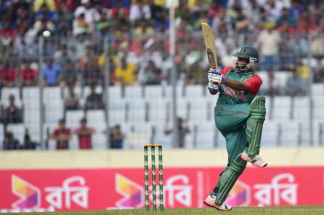 Bangladesh cricketer Tamim Iqbal plays a shot during the first one-day international (ODI) match between Bangladesh and Zimbabwe at the Sher-e Bangla National Stadium in Dhaka on November 7, 2015. AFP PHOTO/ Munir uz ZAMAN (Photo credit should read MUNIR UZ ZAMAN/AFP/Getty Images)