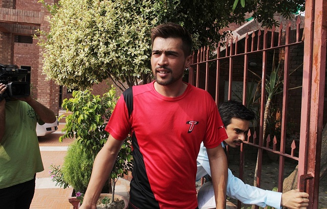 Pakistani cricketer Mohammad Amir arrives at the Pakistan Cricket Board's headquarters in Lahore, Pakistan, Wednesday, Aug. 26, 2015. Pakistan's three cricketers will have to undergo a six-month extensive rehabilitation program before they can return to international cricket after their five-year ban ends on Sept. 1. (AP Photo/K.M. Chuadary)