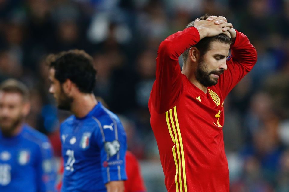 Spain's defender Gerard Pique reacts during the WC 2018 football qualification match between Italy and Spain on October 6, 2016 at the Juventus stadium in Turin / AFP PHOTO / Marco BERTORELLOMARCO BERTORELLO/AFP/Getty Images