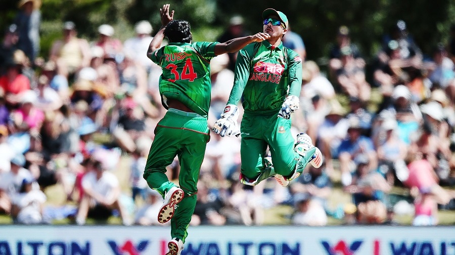 MOUNT MAUNGANUI, NEW ZEALAND - JANUARY 08:  Rubel Hossain of Bangladesh celebrates with teammate Nurul Hasan on a LBW to dismiss James Neesham of New Zealand during the third Twenty20 International match between New Zealand and Bangladesh at Bay Oval on January 8, 2017 in Mount Maunganui, New Zealand.  (Photo by Anthony Au-Yeung/Getty Images)